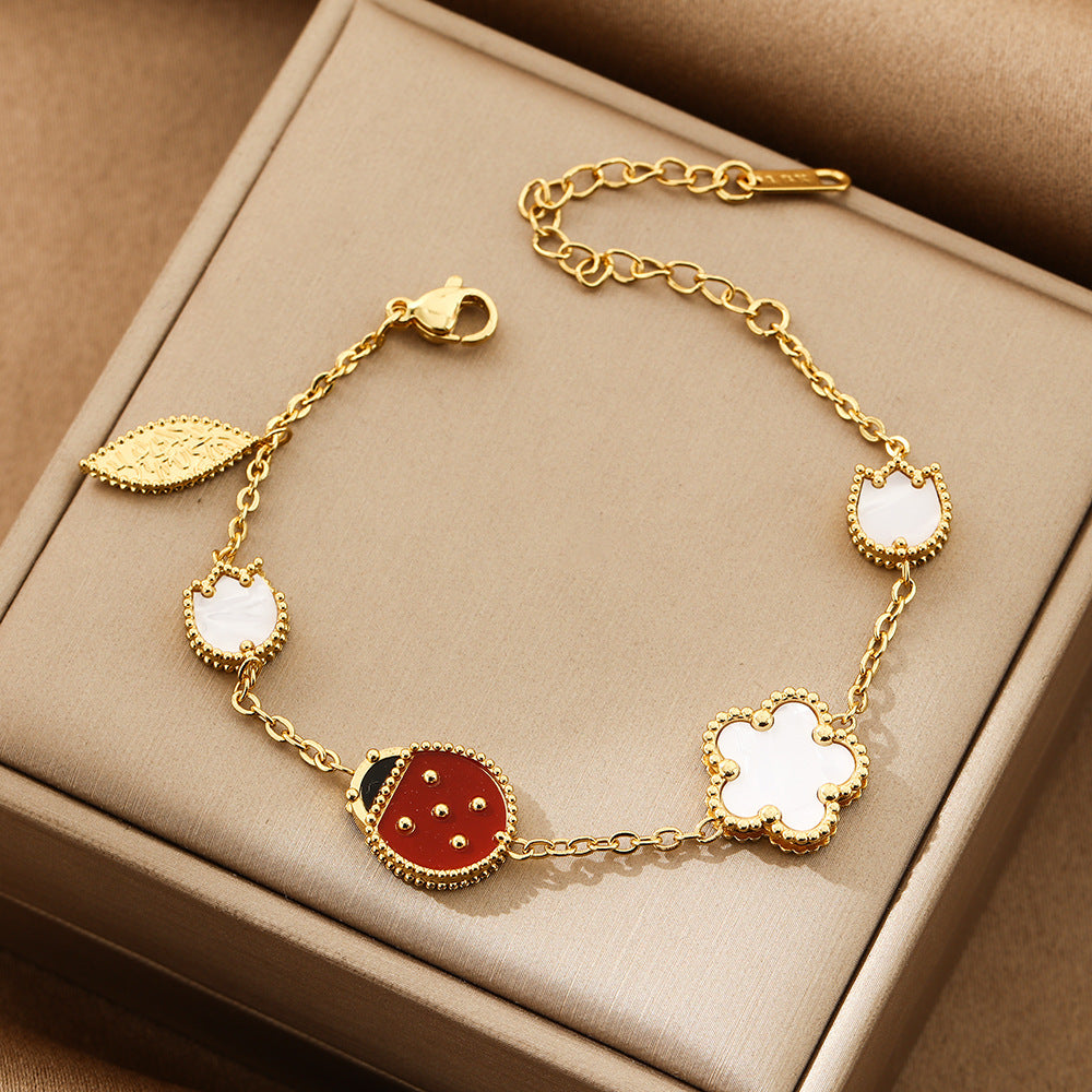 Bracelet Fleur Coccinelle Acier Inoxydable Doré | Boutique84