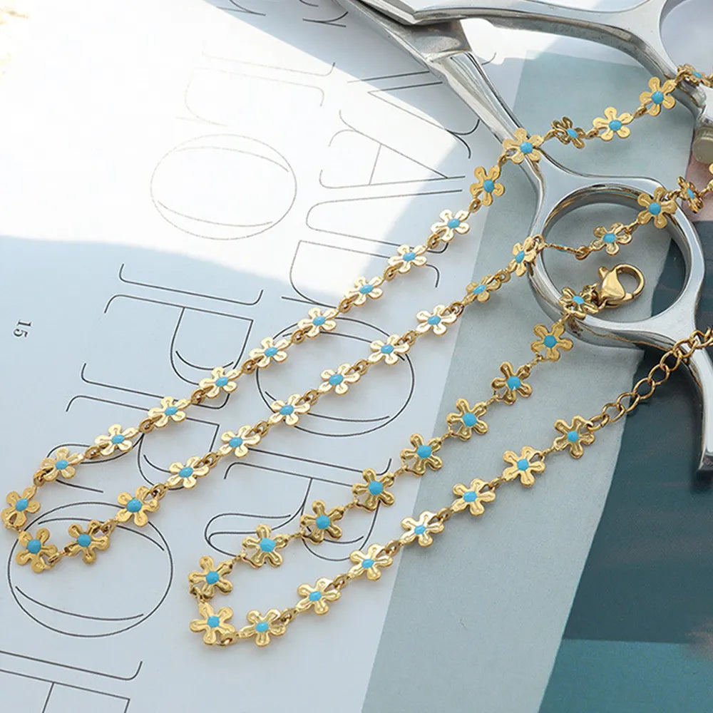 Bracelet Fleur Émaillée Bleue Acier Titane Doré | Boutique84