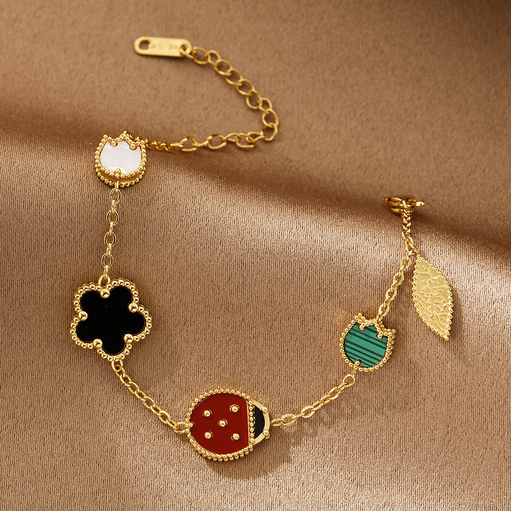 Bracelet Fleur Coccinelle Acier Inoxydable Doré | Boutique84